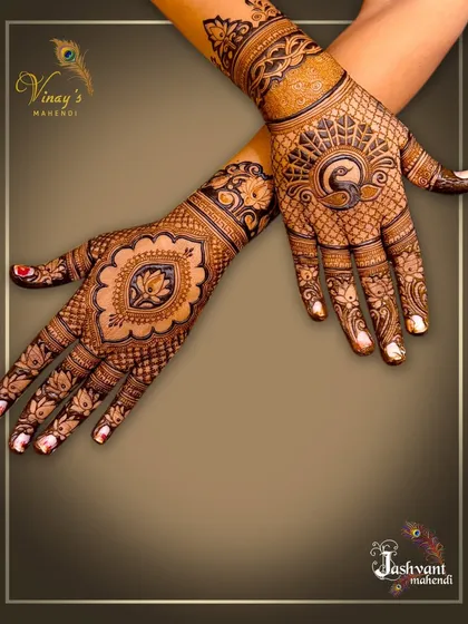 A classic design with a central lotus motif on one hand and a peacock on the other, showing different options for guests.