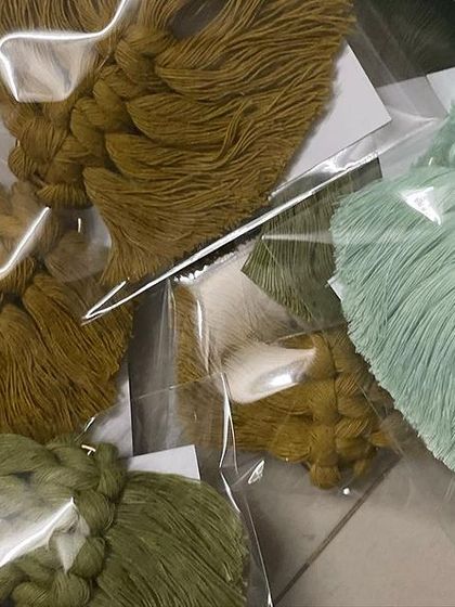 A close-up of my leaf keychains in earthy green tones. These were part of a large corporate gift order.