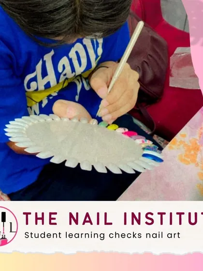 This student is practicing checks nail art on a color wheel, perfecting her line work and spacing for this classic design.