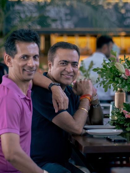 Friends enjoying each other's company at our Golden Circle event, where new friendships bloom over great food and drinks.