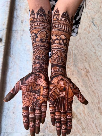 A full view of another Bridal Extravaganza design, with bride-groom figures, elephants, and temple tops, creating a story of royalty and celebration.