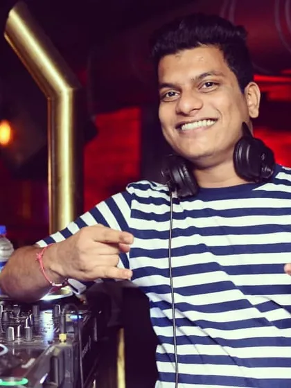 Having a great time behind the decks. My job is to make you dance, and I love every minute of it.