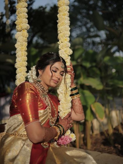 A moment of quiet contemplation. The bride's serene expression is enhanced by a soft, natural makeup look that is both beautiful and timeless.