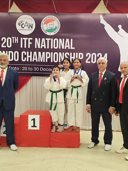 A group of our youngest female competitors celebrating their team's success at the national level.