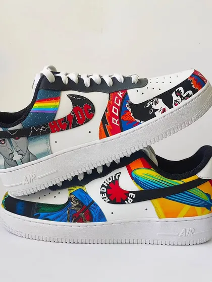 A shot showing both shoes of the Rock and Roll AF1s. It's a mismatched yet perfectly in-sync pair that tells the story of classic rock.