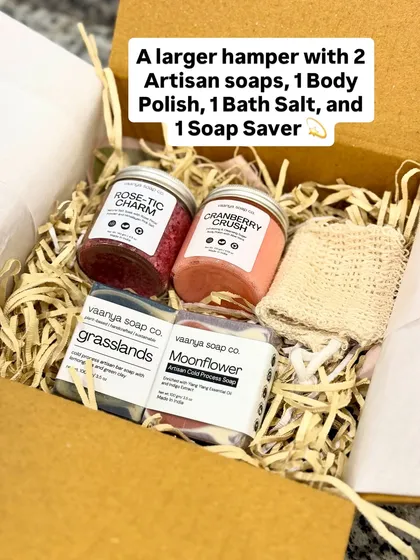 Here is a look inside one of our larger custom hampers. This set includes two artisan soaps, a body polish, a bath salt, and a natural soap saver, all nestled in eco-friendly shredded paper. We can create gift boxes like this for any budget or occasion.
