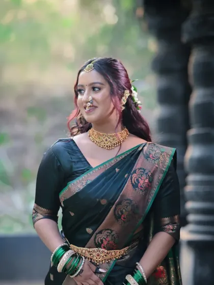 Another angle of this traditional look, showing the beautiful embroidery on the saree and the soft, natural-looking makeup.