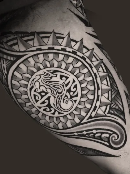 A close-up of the intricate Polynesian patterns representing Shankar's family story, featuring symbols for the sun, turtle, seahorse, and starfish.