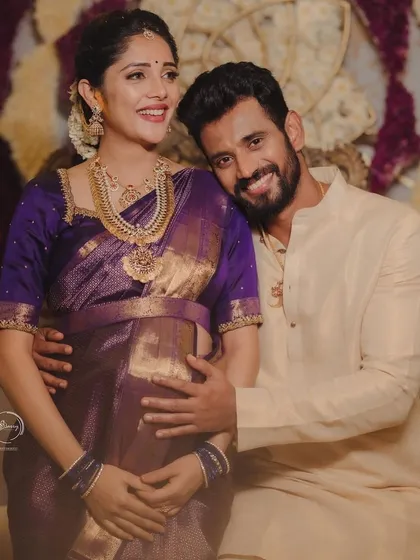 Being part of Milana and Krishna's journey, especially for their beautiful baby shower, has been an absolute joy. We designed this traditional purple Kanjeevaram saree and blouse to celebrate this precious new beginning for their family.