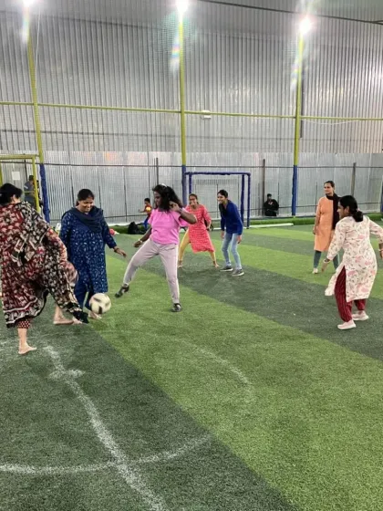 Football is for everyone. Here, you'll find a welcoming and supportive environment where adults of all genders and skill levels come together for the love of the game. This shot from our community fest captures the pure joy and camaraderie we foster.