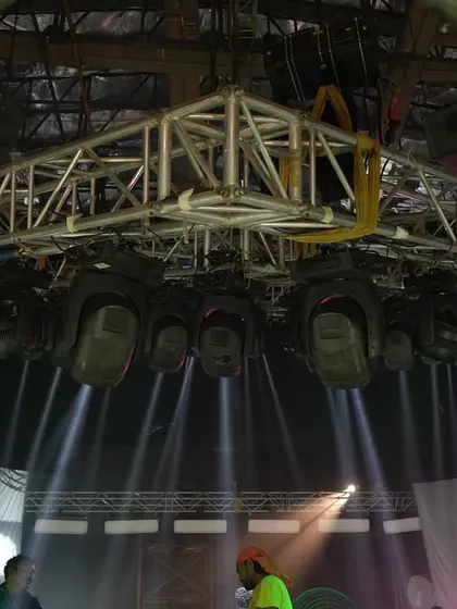 A low-angle shot of the overhead truss for the 'Po Po' song, showing the density of Claypaky Mythos fixtures used to create the powerful effects.
