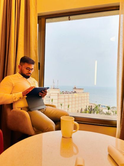 A moment of quiet preparation with a sea view in Visakhapatnam. Striking a harmony between work, leisure, and advocacy is key to a well-lived life.