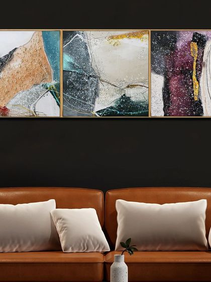 A three-panel abstract painting that combines various textures and colors. The mix of earthy tones, deep purples, and sparkling details creates a complex and intriguing piece of art.