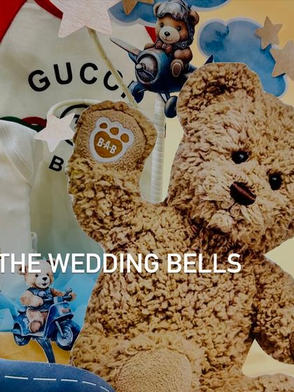 Halfway to one. This hamper for a baby boy's six-month celebration features adorable teddy bear-themed outfits from Gucci and Ralph Lauren.