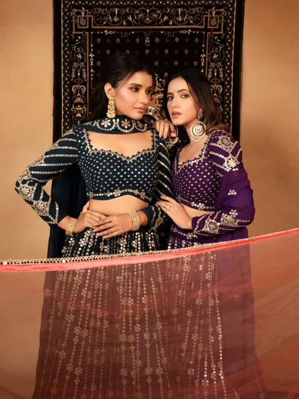 A beautifully composed shot of two models for a brand campaign. The image highlights the intricate blouse designs and the models' chemistry, creating an aspirational look.