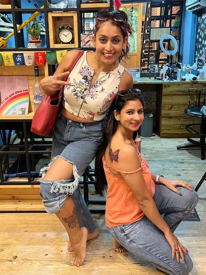 Friendship goals. Two friends came in together to get matching butterfly tattoos, each in a different placement to suit their style.
