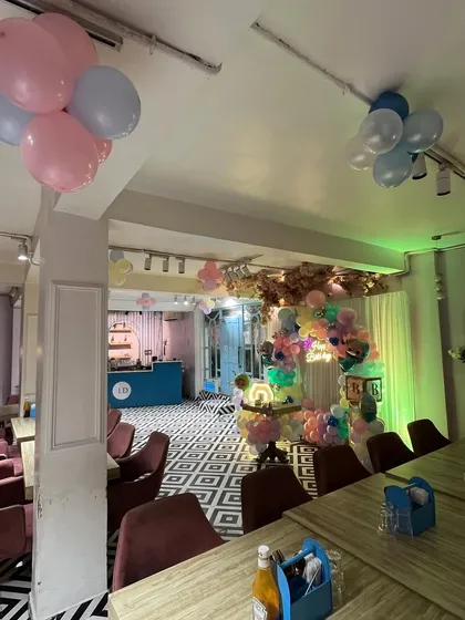 Another wide view of the decorated cafe, showing how I can transform any space for a party.