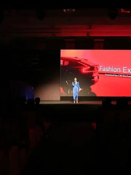 A wide view of the stage at the Volvo C40 launch event. The large screen and dramatic lighting are tools I use to create a powerful and immersive brand experience for the audience.