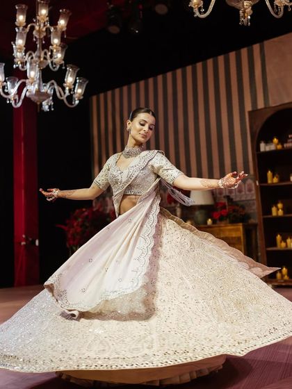 The bride twirling on the dance floor, her lehenga creating a beautiful circular shape.