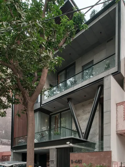 Another view of the Paschim Vihar project, showing how the cantilevered balconies and large glass panels create a sense of lightness and transparency.