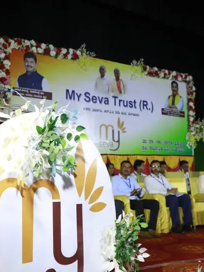 A wider shot of my speech, with the 'My Seva' branding prominently displayed, representing our collective service.