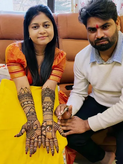 Me and a happy bride posing with her finished mehandi. It's always an honor to be part of such a special day.