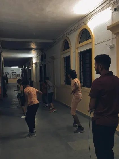 I closely supervise a footwork drill session. Proper footwork is the most important skill in fencing, allowing a player to control distance and create opportunities.