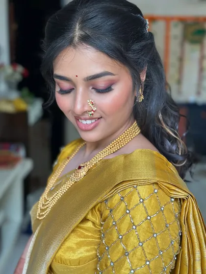 A smiling shot of the bride-to-be, looking absolutely radiant and happy.