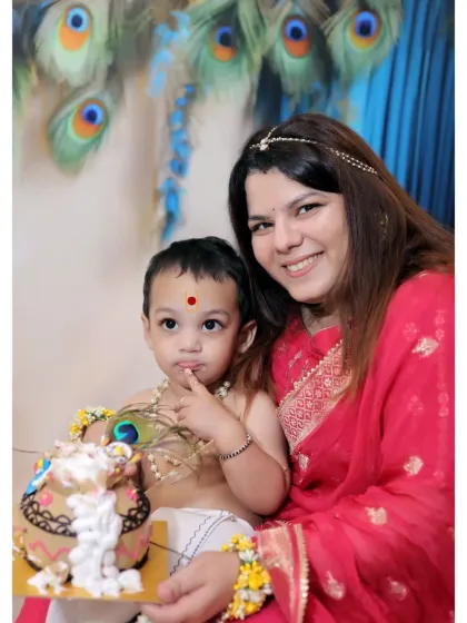A beautiful portrait of a mother and her son in a Krishna-themed shoot, capturing a moment of quiet connection.