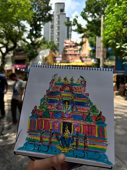 A wide-angle shot of my colourful Ahobilam temple sketch, with the real temple visible in the background. This shows how I translate a real-life scene into my vibrant artistic style.