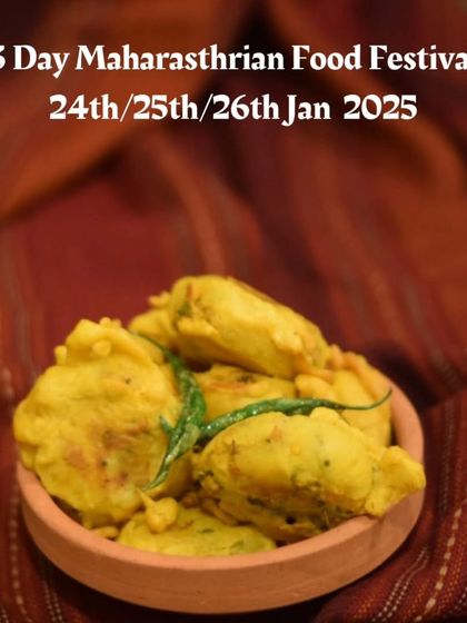 A bowl of Batata Wada, a classic Maharashtrian snack, ready for the food festival in Chennai. These spiced potato fritters are crispy on the outside, soft on the inside, and incredibly addictive.