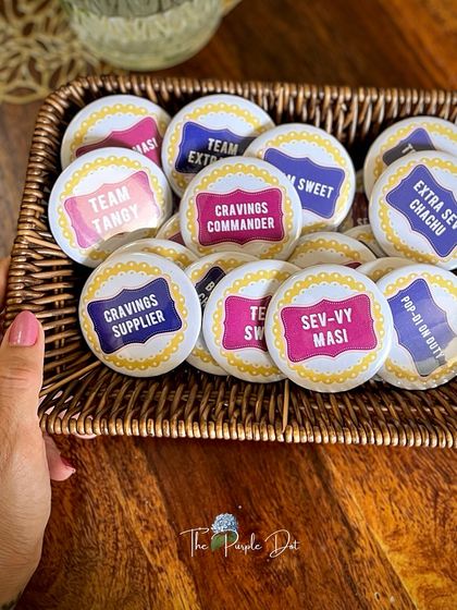 Custom-designed badges for a chaat-themed celebration, a fun and quirky party favor for guests.