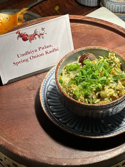 A different angle of the Undhiya Pulao, showcasing the mix of winter vegetables and fragrant rice. It's a comforting yet elevated dish that celebrates regional Indian cuisine.