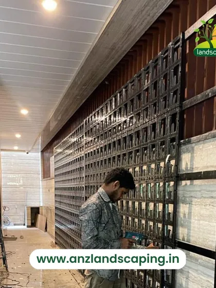 A duplicate of media ID 19. Here, one of our experienced technicians is securing the vertical garden panels to the support structure. We ensure every component is perfectly aligned and safely installed before any planting begins.