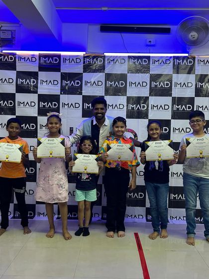 A group of proud students with their instructor after the annual show.