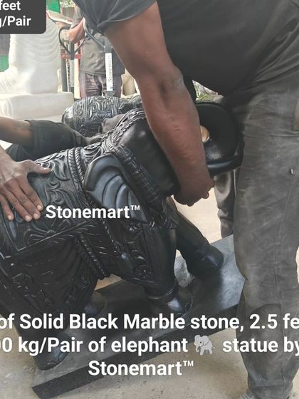 A close-up of our artisans working on a 2.5-foot, solid black marble elephant statue. These pieces feature intricate, traditional carvings and are a testament to our craftsmanship.