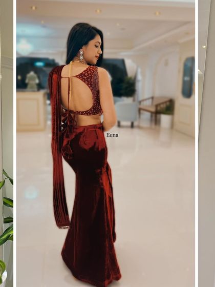 For a sizzling reception or cocktail look, I designed this maroon velvet outfit. It features a sleek fish-cut skirt paired with a dazzling crystal-embellished blouse and a pre-draped dupatta for effortless glamour.