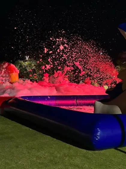 My foam machine in action during a night party. The foam fills the inflatable pool, creating a fun and safe play area for kids.