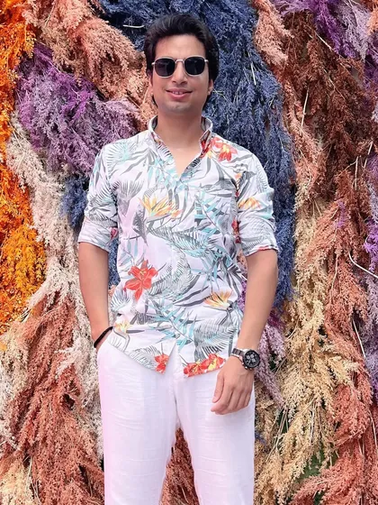 Another shot against this incredible floral wall. The vibrant background perfectly matches my mood as I head into a new season of events.