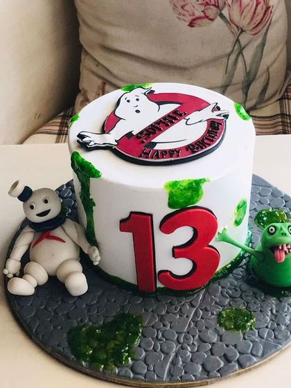 "Who you gonna call?" A Ghostbusters cake for a 13th birthday, featuring the iconic logo, Slimer, and the Stay Puft Marshmallow Man.