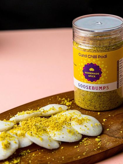 A beautiful spread of mini idlis sprinkled with my Curd Chilli Podi. This unique South Indian spice blend combines tangy curd and fiery chilli, creating a versatile seasoning that elevates any dish.