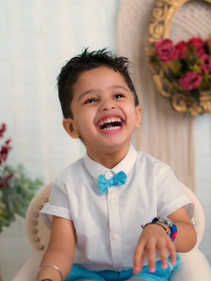 A laugh that is pure music. This little boy's joyful expression is the best part of this fun and happy toddler photoshoot.