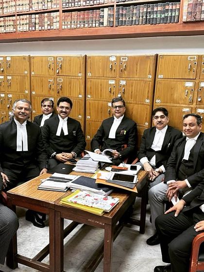 Taking a brief coffee break with colleagues during a busy afternoon at the Delhi High Court. These moments of conversation are essential for collaboration and strategy.