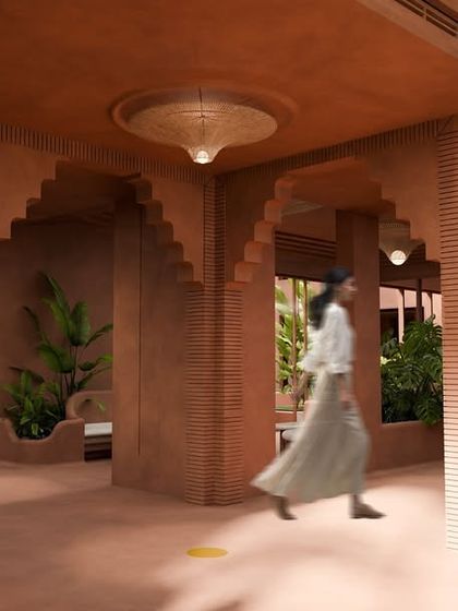 From the calm corridors, the journey unfolds in terracotta tones and sculpted arches. Light filters through woven lamps, and greenery softens every edge.