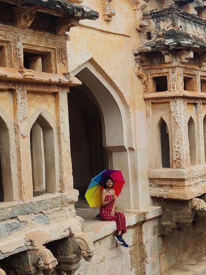 Finding a quiet spot at the Queen's Bath in Hampi. The intricate architecture provides endless opportunities for beautiful photos.