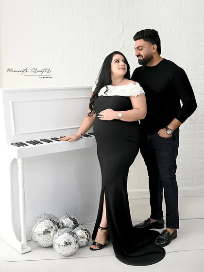 Classic elegance with a modern touch. This couple's portrait features my white piano prop and disco balls for a fun yet sophisticated look, showing how we can blend different styles into one session.