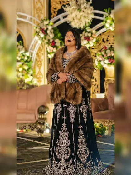 Dressed in a classic black gown with a fur stole for a winter Sangeet ceremony at Manu Maharani, Jim Corbett. It’s important for me to match the theme and elegance of a destination wedding.
