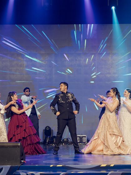 A playful moment between the groom and his friends. The choreography included this fun segment where the girls try to win his attention, adding a lighthearted, competitive twist to the performance.