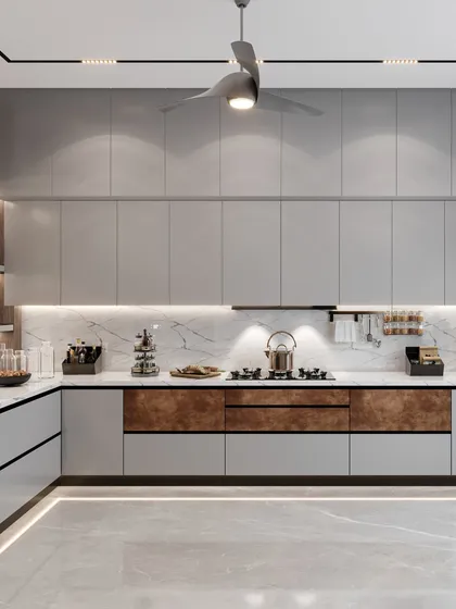 The L-shaped counter provides ample workspace, with brown accents on the lower cabinets to break the monotony. We used the same marble for the countertop and backsplash for a seamless look.