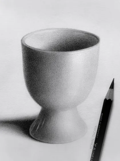 A study of a small ceramic cup. This exercise focuses on capturing the subtle curves and smooth finish of a ceramic object.